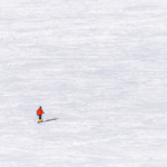 Lago Bianco. A lone langlaufer crosses the frozen lake high on the Bernina Pass, Switzerland. 1st by Philip Walton